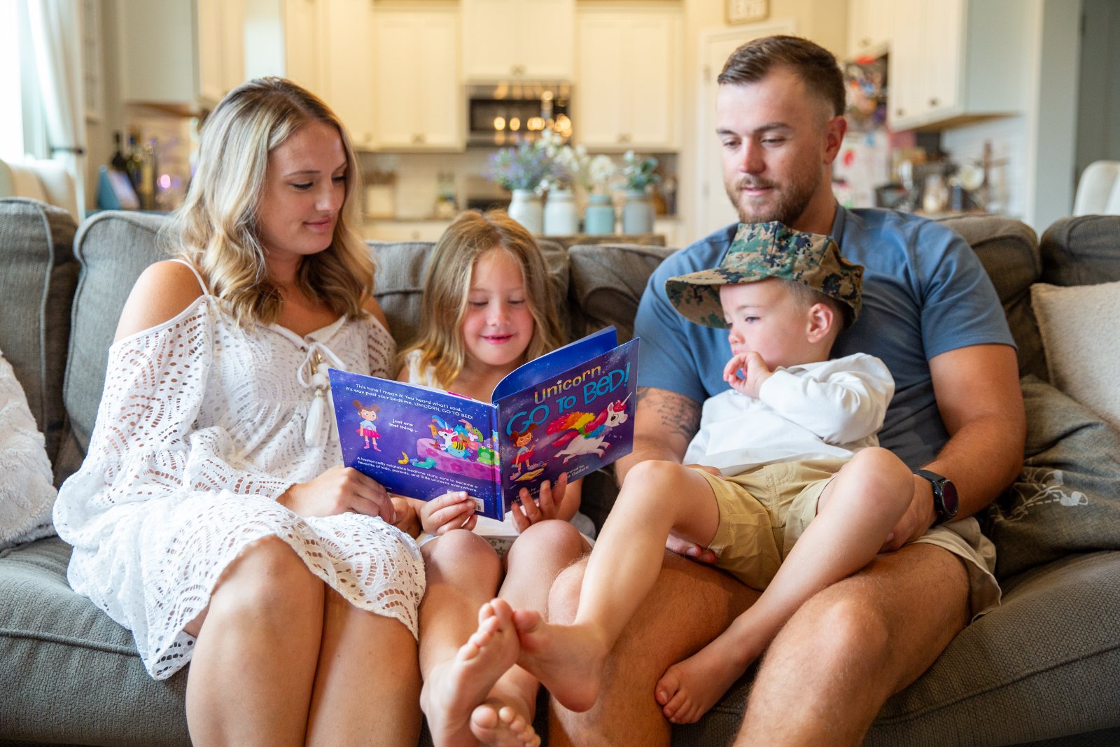 A Marine and his family read together on the couch